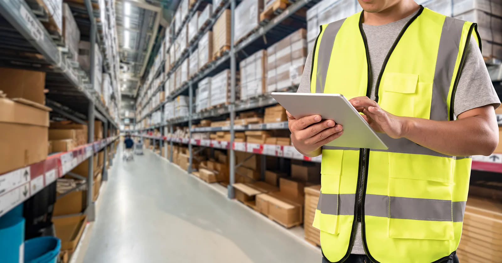 Warehouse worker using a tablet on a wireless network